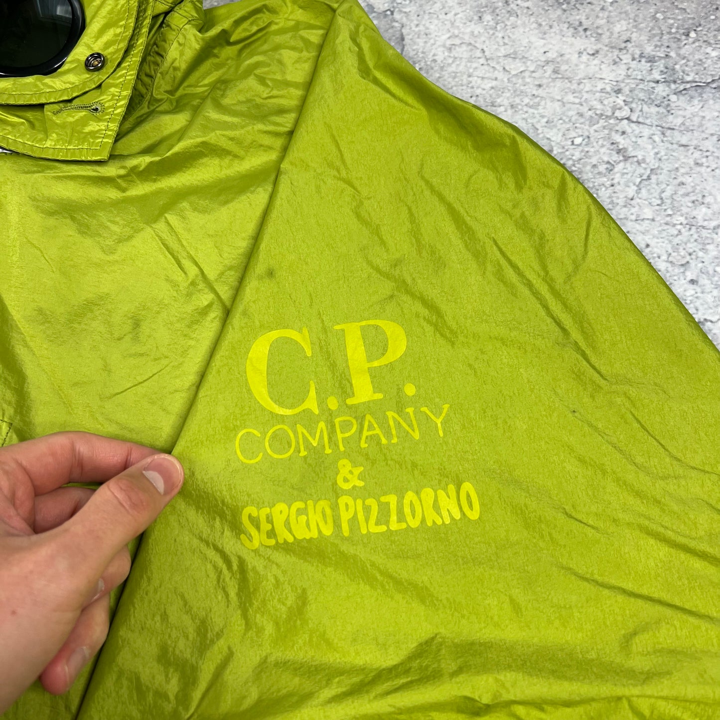CP Company x Serge Pizzorno Goggle Poncho